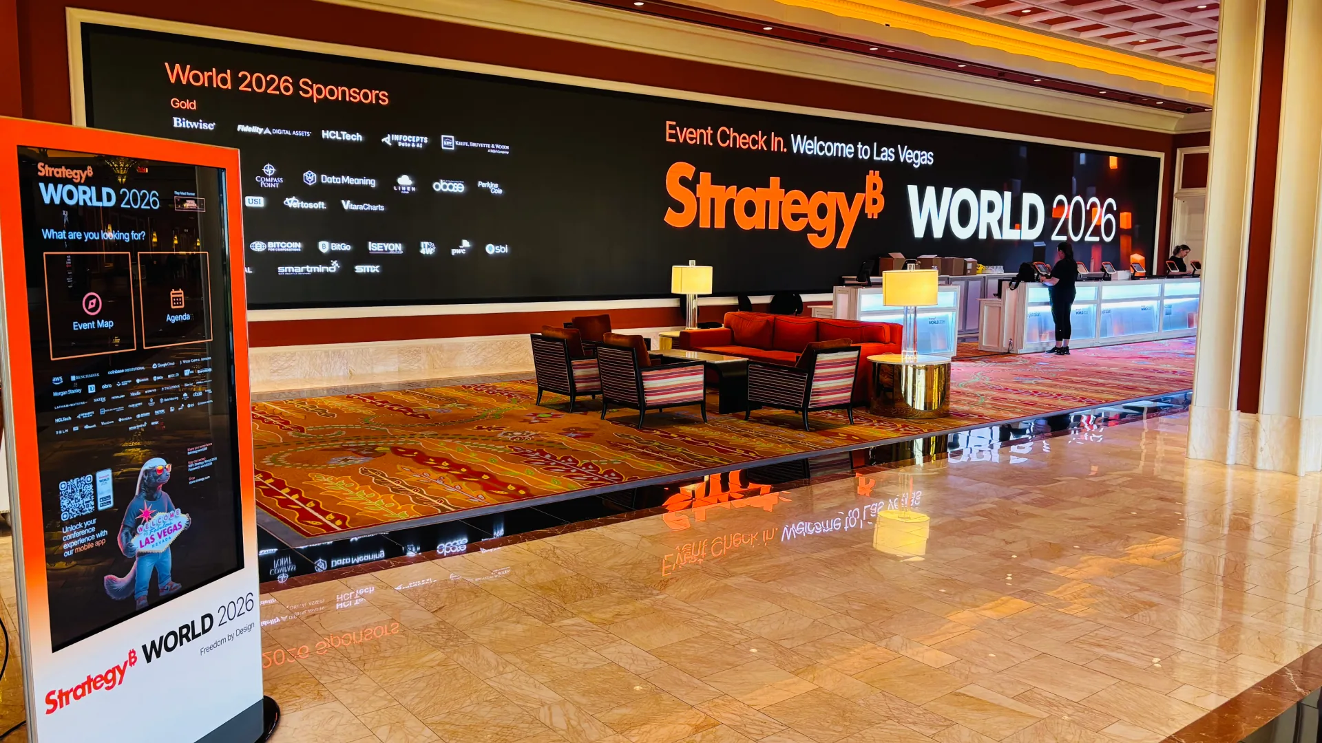 Strategy World 2026 — event check-in and sponsor wall